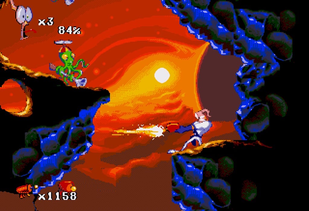 Imagem do protanista do game "Earthworm Jim 2" atirando em seu inimigo. (Divulga&ccedil;&atilde;o / Internet)